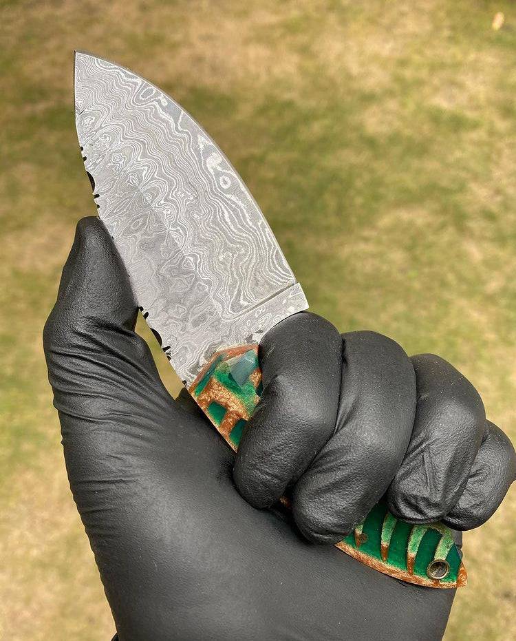 Fixed blade EDC knife with Damascus steel blade by cskforged, featuring a textured handle and sturdy construction.