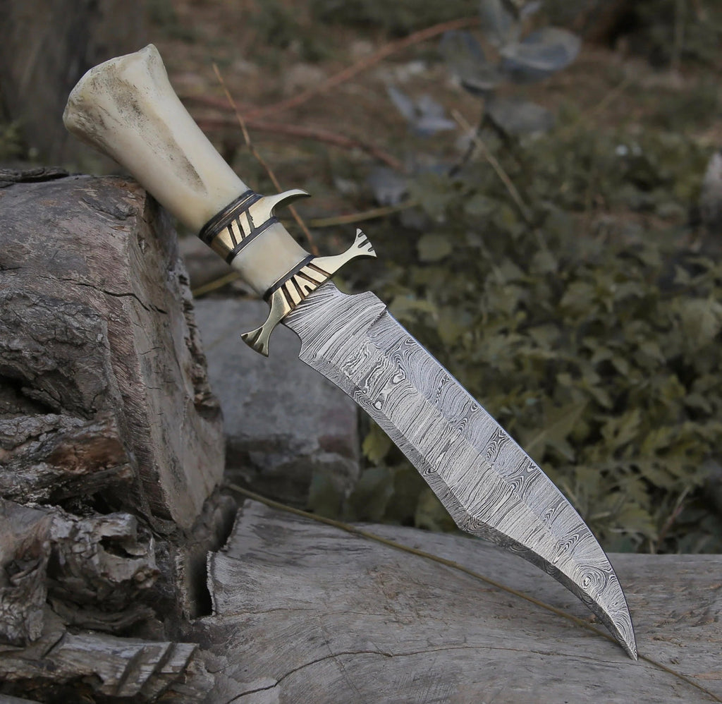 Custom handmade Damascus steel hunting Bowie knife with intricate pattern and leather sheath from Knives Gear Garage.