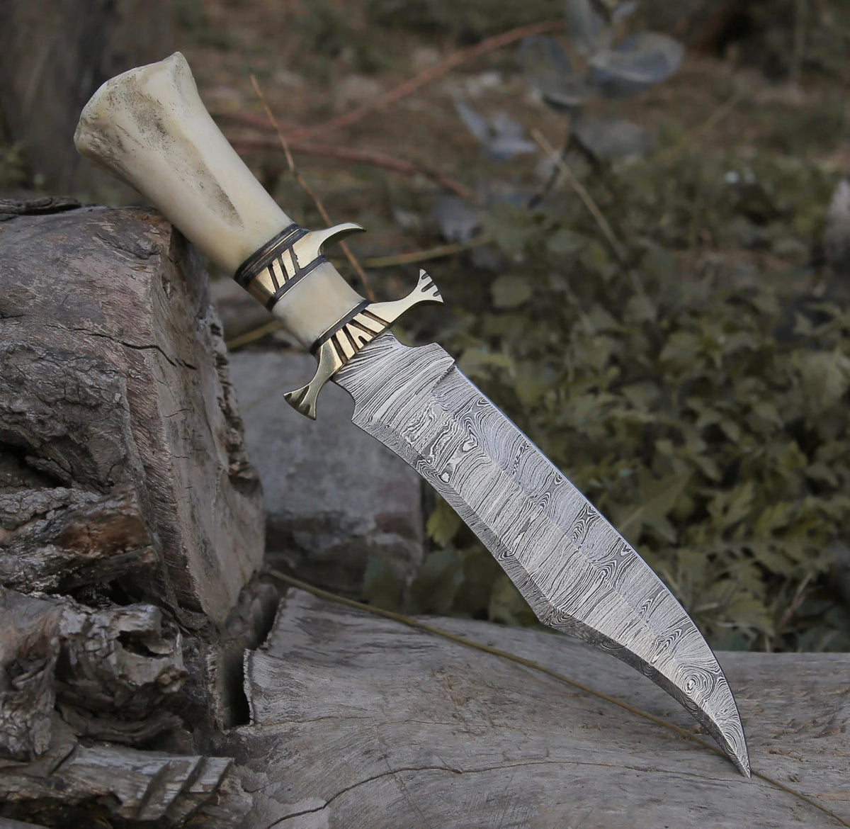 Custom handmade Damascus steel hunting Bowie knife with intricate pattern and leather sheath from Knives Gear Garage.