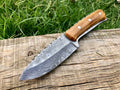 Full tang custom handmade Damascus steel hunting skinning knife with a textured handle and sharp blade, ideal for outdoor skinning tasks.
