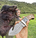 Handmade Damascus steel Guthook Skinner hunting knife with custom handle by Knives Gear Garage, showcasing the sharp blade and detailed craftsmanship.