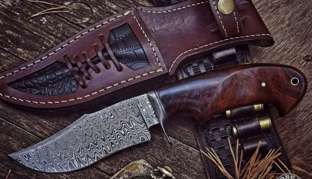 Handmade hunting bushcraft knife with Damascus steel blade and walnut wood handle, perfect for survival and EDC tasks.