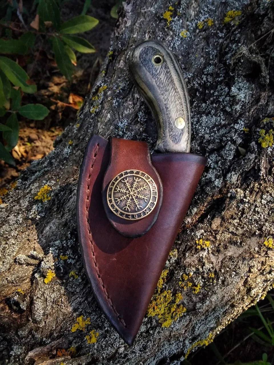 Handmade cskforged Viking fixed blade skinning knife with a sharp, durable blade and leather-wrapped handle.