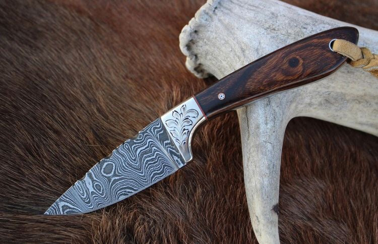 Knives Gear Garage Buckaroo belt knife with 7-inch Damascus blade, rosewood handle, and Western leather sheath.