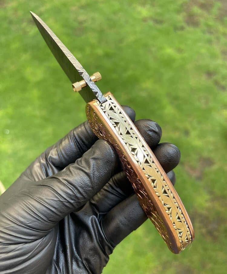 Custom handmade Damascus blade EDC folding pocket knife by cskforged, featuring a textured Damascus steel handle and sleek folding design.