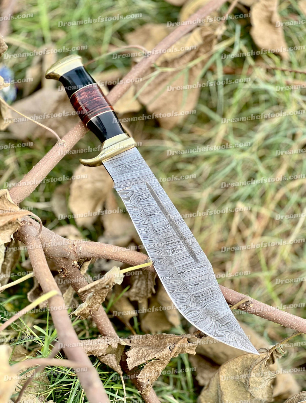 Handmade Damascus Steel Crocodile Dundee Bowie Knife with buffalo horn handle, brass guard, and leather sheath by Knives Gear Garage.