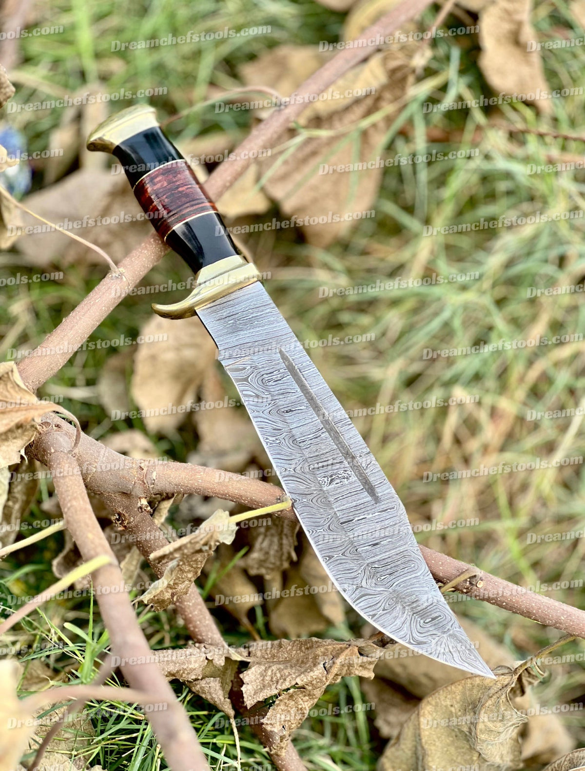 Handmade Damascus Steel Crocodile Dundee Bowie Knife with buffalo horn handle, brass guard, and leather sheath by Knives Gear Garage.