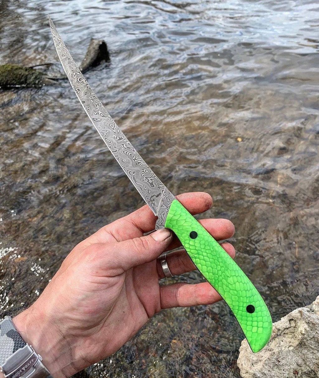 Fixed blade Damascus steel fillet knife by CSKFORGED, ideal for precision fish filleting with a sharp, durable blade.