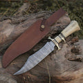 Custom handmade Damascus steel hunting Bowie knife with a textured handle and sharp blade, crafted by Knives Gear Garage