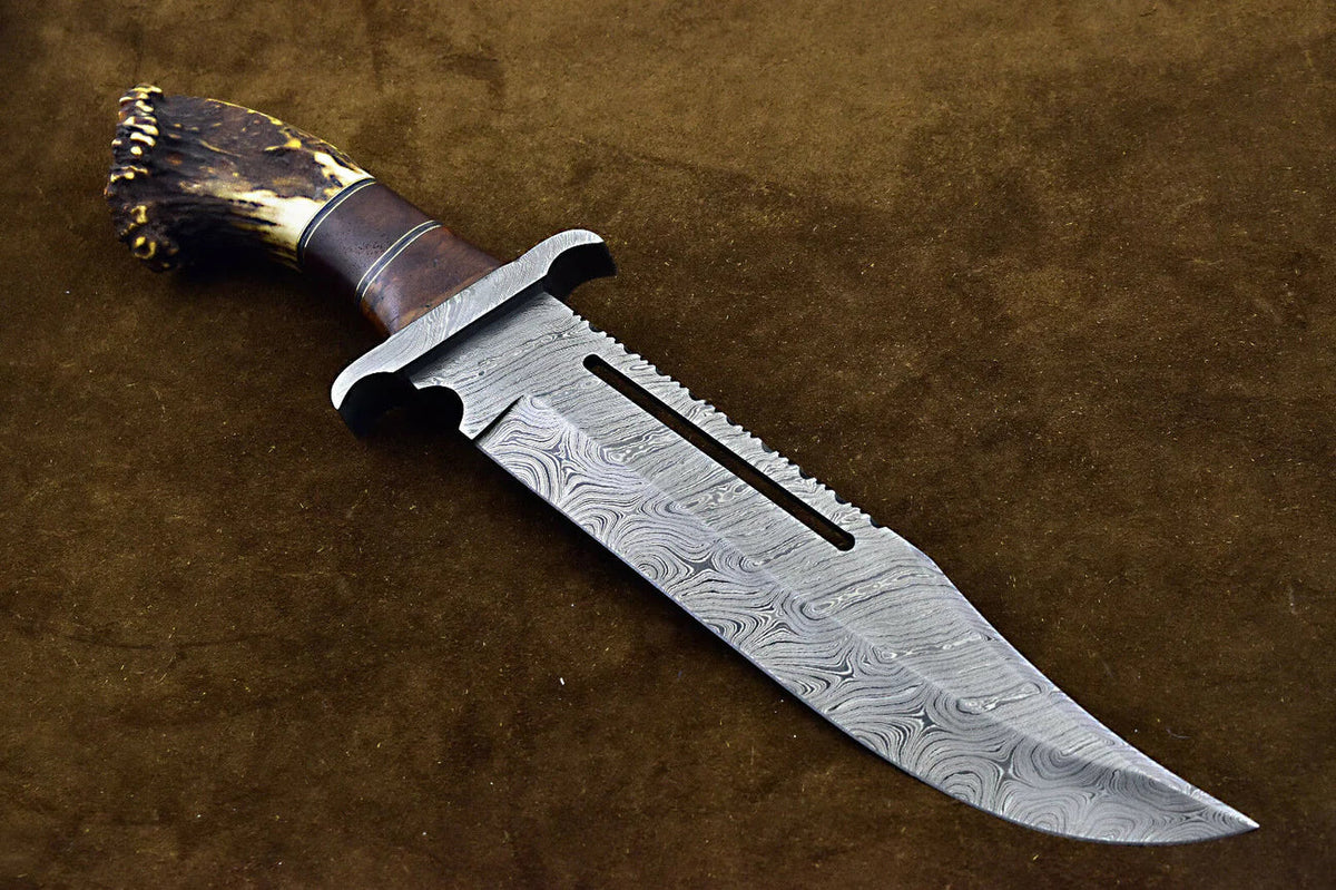 Custom handmade Damascus steel hunting Rambo Bowie knife with stag horn handle, featuring intricate blade pattern and durable construction.