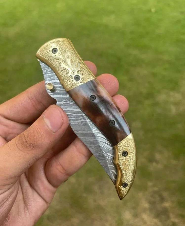 Damascus Blade EDC pocket knife by cskforged with a patterned Damascus steel blade and a sleek handle, ready for everyday carry.