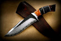 Handmade D2 steel hunting knife with custom wooden handle from Knives Gear Garage, showcasing its sharp blade and craftsmanship.