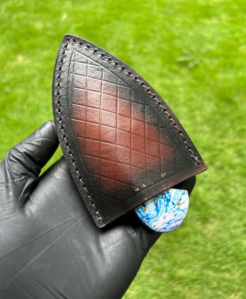 Fixed blade handmade Damascus steel skinning knife by cskforged, featuring a textured handle and sharp blade for outdoor use.