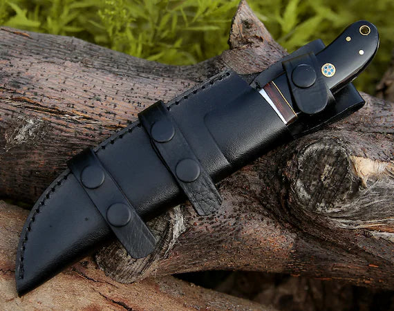 Custom handmade Damascus hunting knife by Knives Gear Garage with rosewood and buffalo horn handle, steel bolster, 9-inch blade, leather sheath.