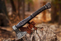 Handmade Viking axe with wooden handle and metal blade, custom craftsmanship by Knives Gear Garage.
