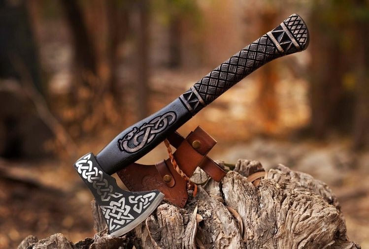 Handmade Viking axe with wooden handle and metal blade, custom craftsmanship by Knives Gear Garage.
