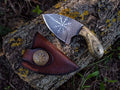 Handmade Viking skinning knife by cskforged with a fixed blade, featuring a textured handle and sharp blade for outdoor use.