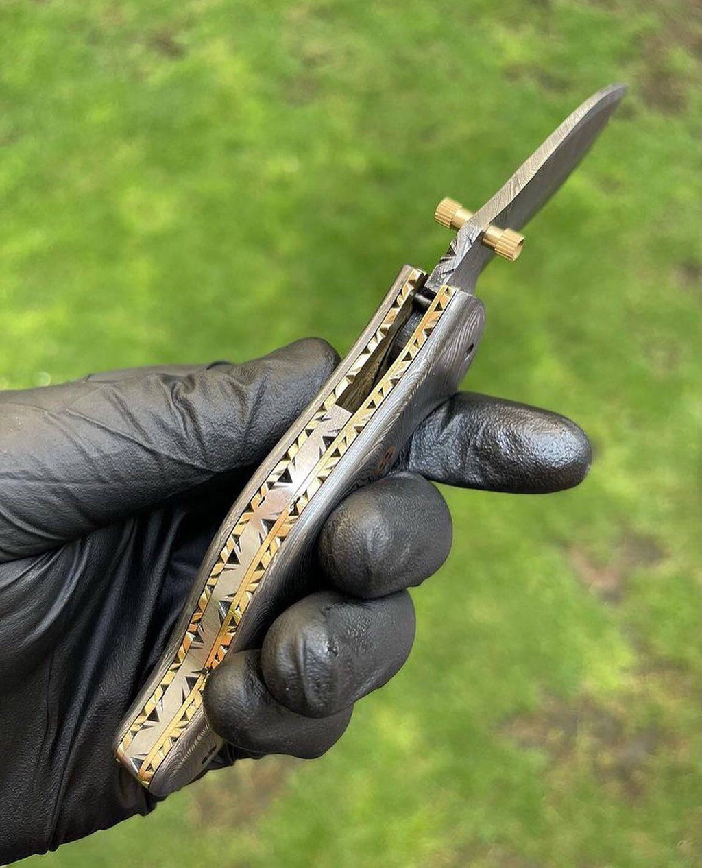 Damascus folding pocket knife with a full blade and textured handle, designed for everyday carry by cskforged.