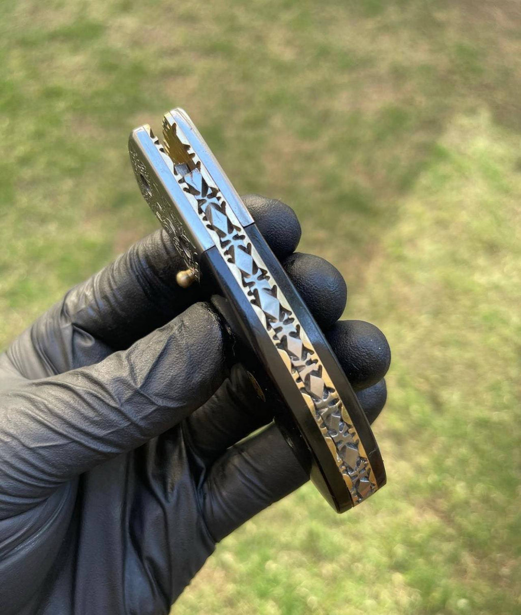 Damascus pocket folding knife by CSK Forged with a patterned blade and ergonomic handle, ideal for everyday carry and outdoor use.