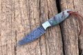 Damascus Knife Store working buckaroo knife with a 6.25-inch sheep horn handle and polished blade, traditional cowboy-style knife.