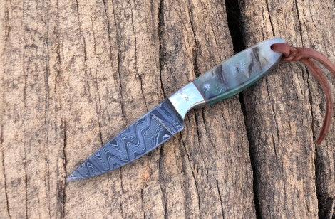 Damascus Knife Store working buckaroo knife with a 6.25-inch sheep horn handle and polished blade, traditional cowboy-style knife.