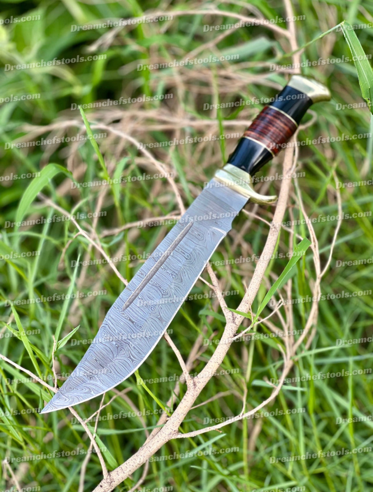 Handmade Damascus steel Crocodile Dundee Bowie Knife with buffalo horn handle, brass guard, and leather sheath.