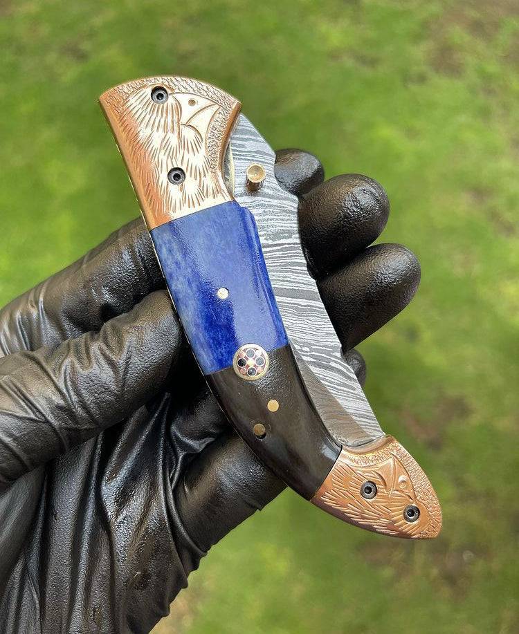 Damascus Blade EDC folding pocket knife by cskforged with a patterned Damascus steel blade and a sleek folding design.