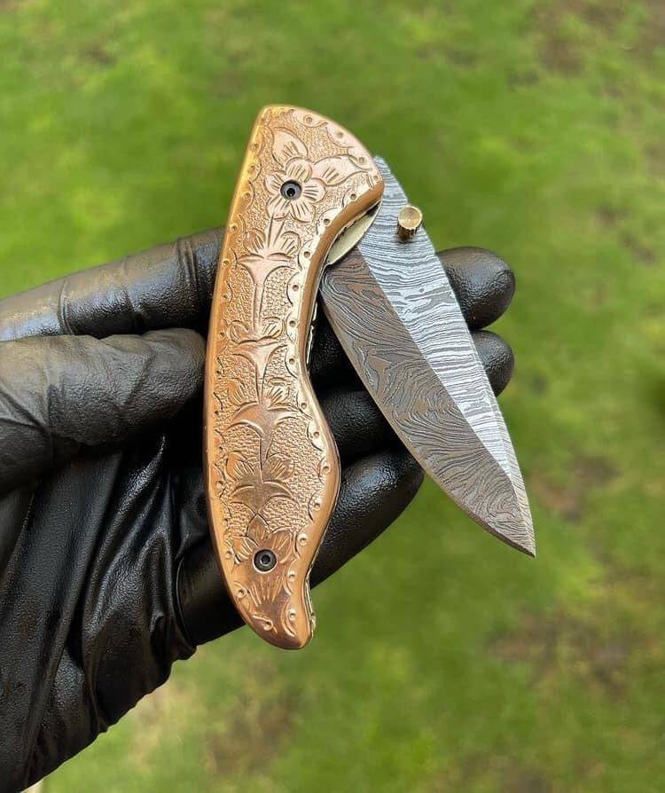Custom handmade Damascus blade EDC folding pocket knife by cskforged with intricate steel pattern and ergonomic handle.