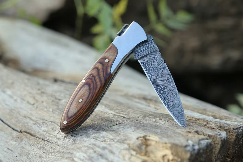 Handmade Damascus pocket knife with brown Pakka wood handle, folding design, by Knives Gear Garage.