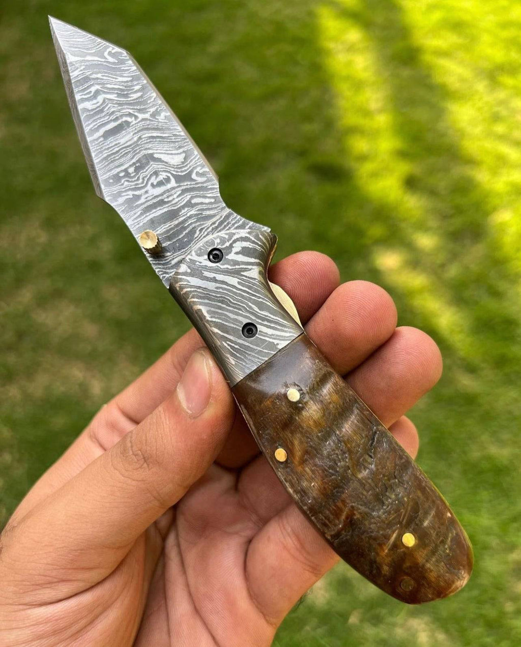 Custom handmade Damascus steel Tanto blade EDC folding pocket knife by cskforged, featuring a detailed, textured steel blade and handle.