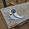 Pair of Damascus steel Karambit knives with stag horn and wood handles, 9-inch blades, crafted by JW SteelCrafts.