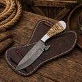 SHAM KNIVES cowboy skinning knife with handmade Damascus blade and resin handle, ideal for outdoor hunting and skinning tasks.