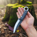 MALIKA KNIVES RingTail D2 hunting knife with Pakka wood handle, featuring a simple design and sharp blade for outdoor use.