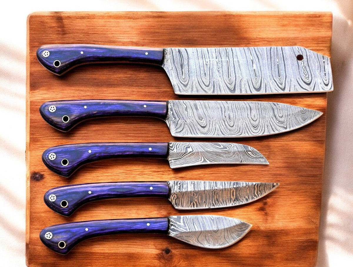 Handmade Damascus kitchen knives set with exotic wood handles, featuring polished blades and ergonomic grips.