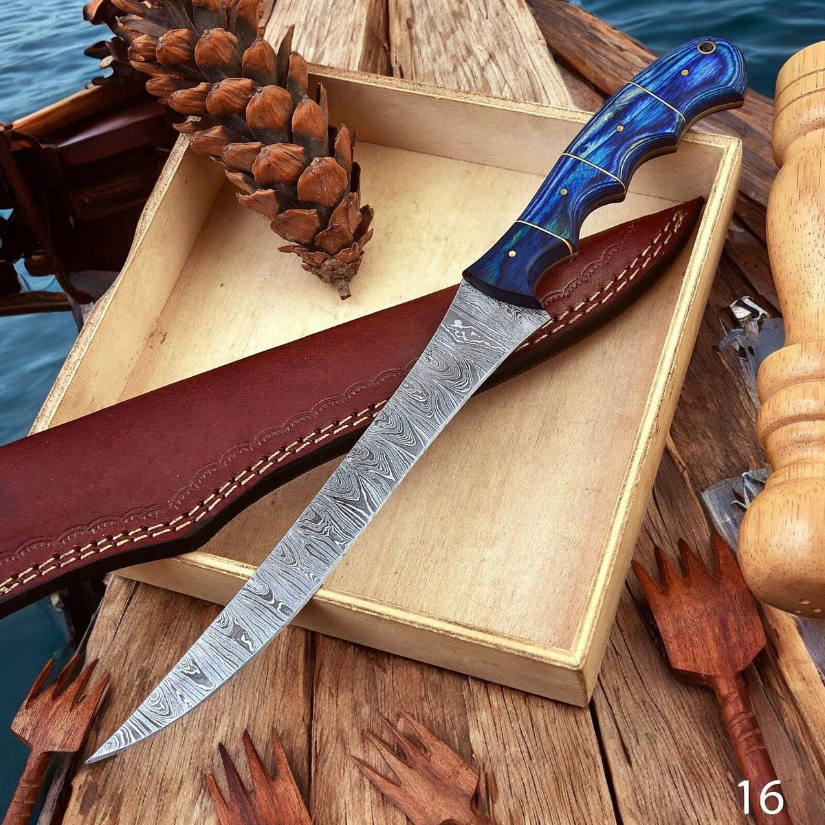 Custom handmade Damascus fillet knife with a 12-inch blade and exotic wood handle, showcasing intricate damascus pattern and craftsmanship.