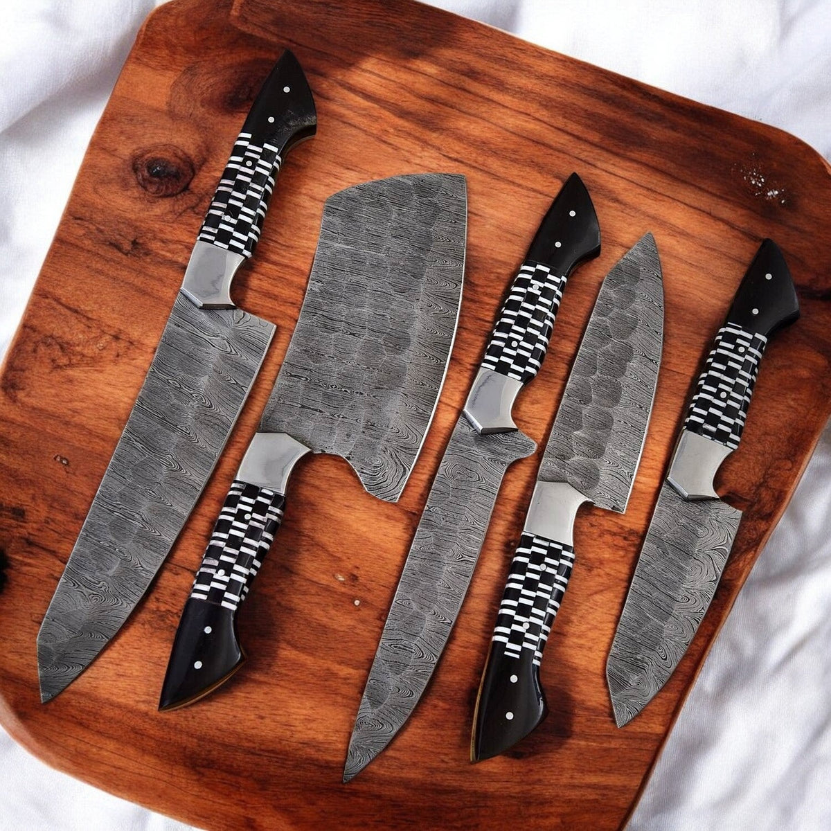 Premium Damascus kitchen knives set with epoxy resin handles, featuring sharp blades and ergonomic design for precise cutting.