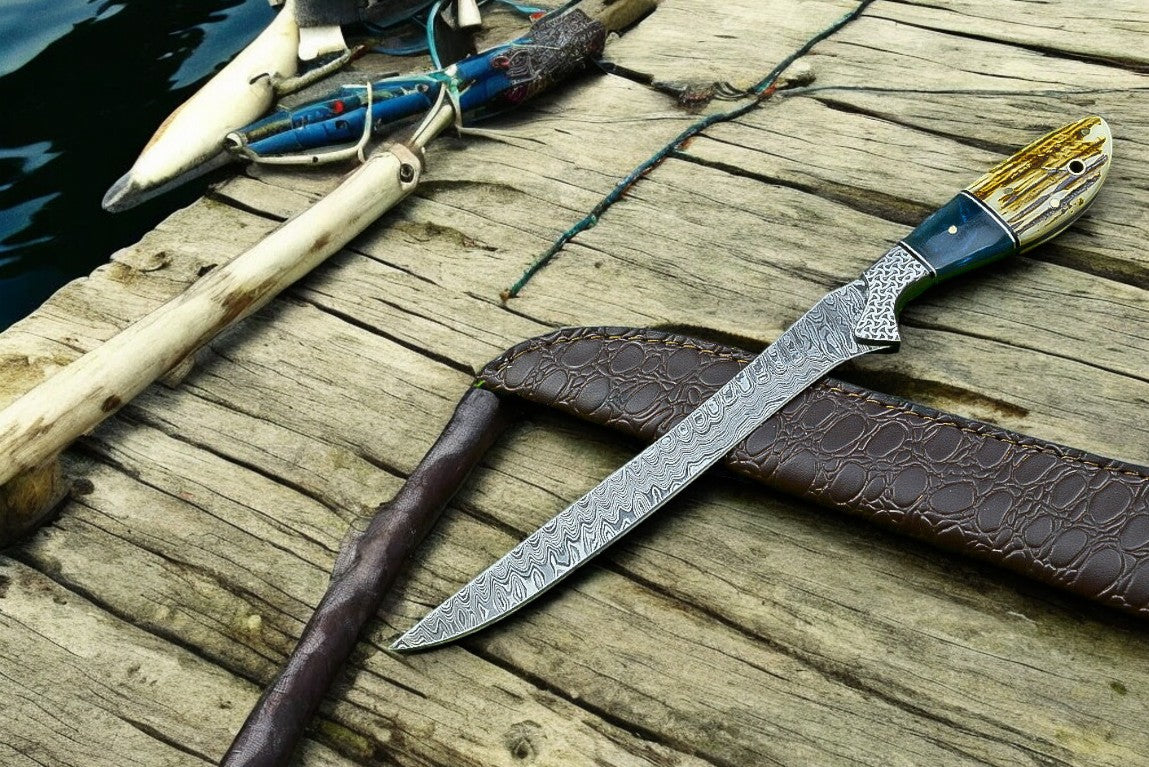Handmade Damascus fillet knife with 12.5-inch blade and leather sheath, featuring intricate Damascus pattern and ergonomic handle.