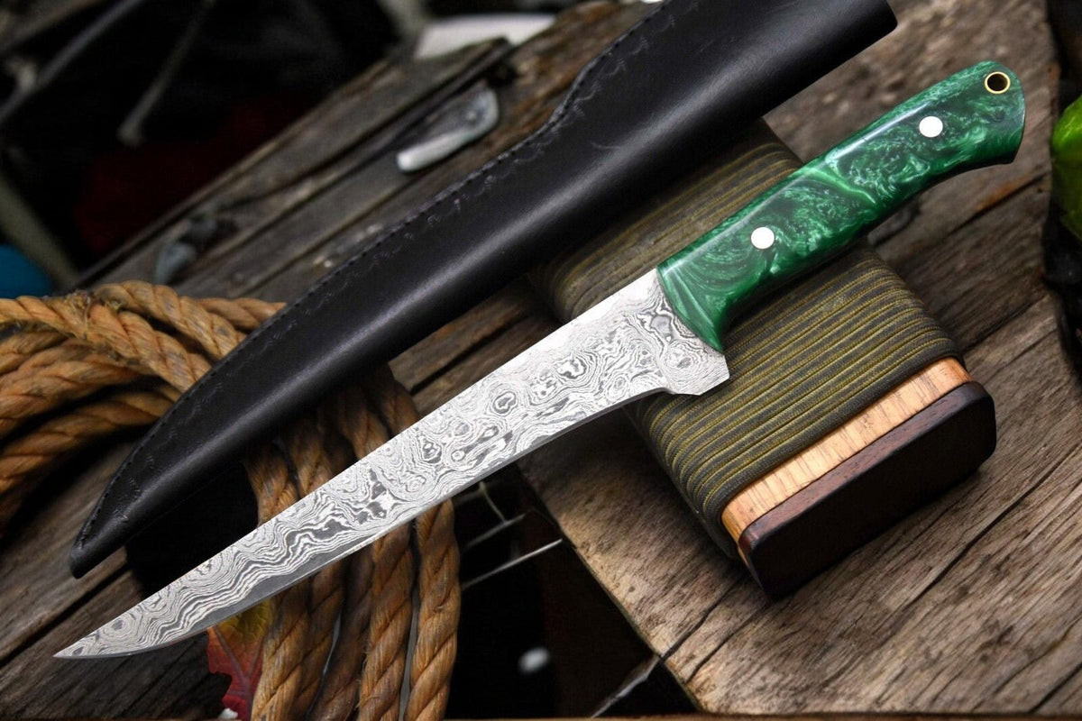 Handmade Damascus fillet knife with a 12.8-inch blade, featuring a polished wooden handle and intricate Damascus steel pattern.