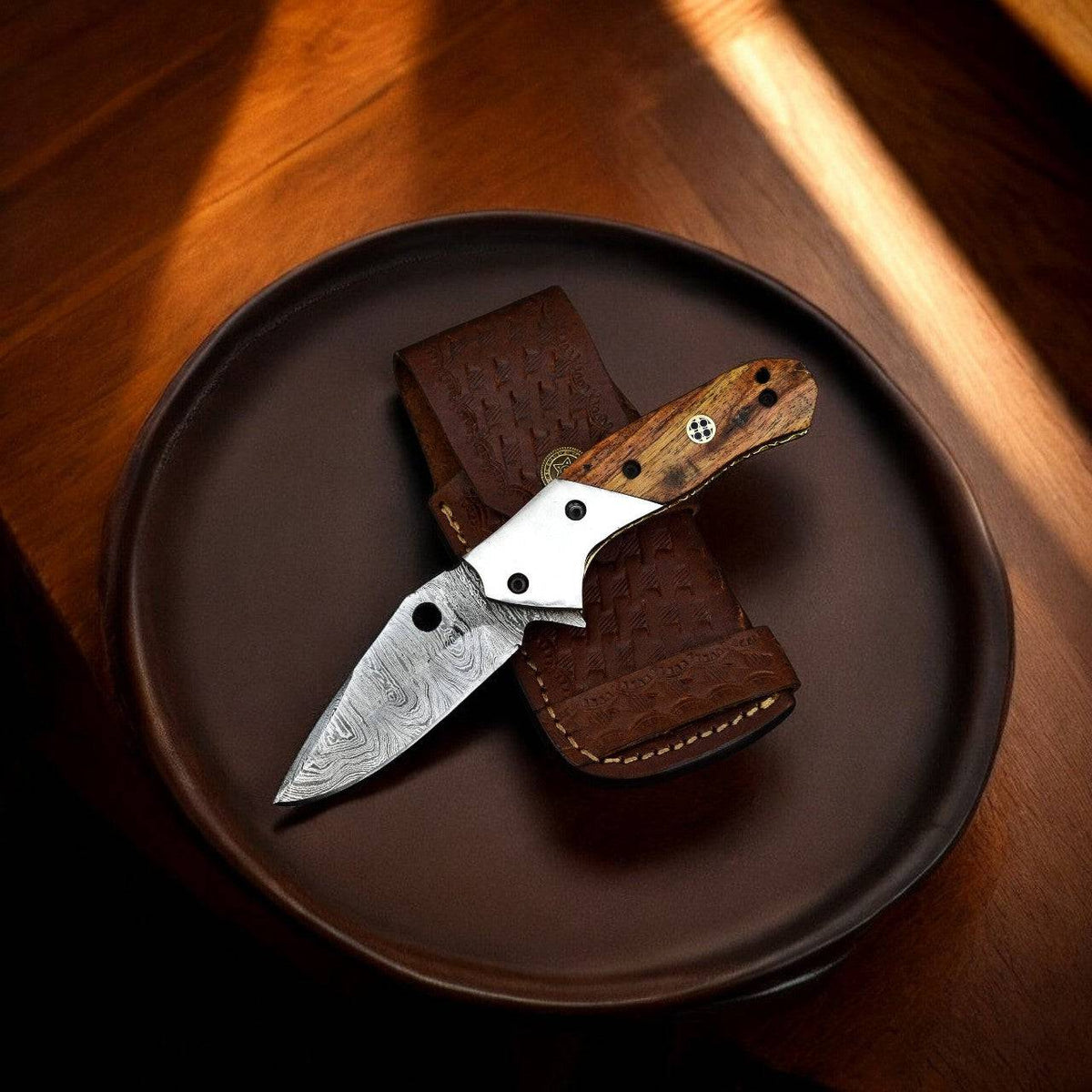 Handmade Damascus wood pocket knife with a sharp blade, featuring intricate Damascus pattern and a polished wooden handle.