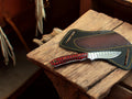 Custom handmade belt knife with rasp tool steel blade, featuring a leather belt sheath from Damascus Knife Store.