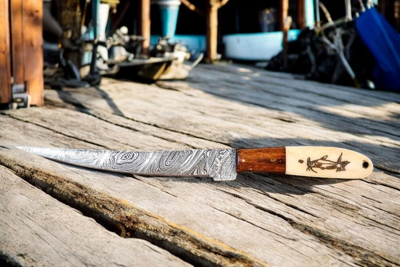 Custom handmade Damascus fillet knife with a 13-inch blade, featuring a bone and wood handle.