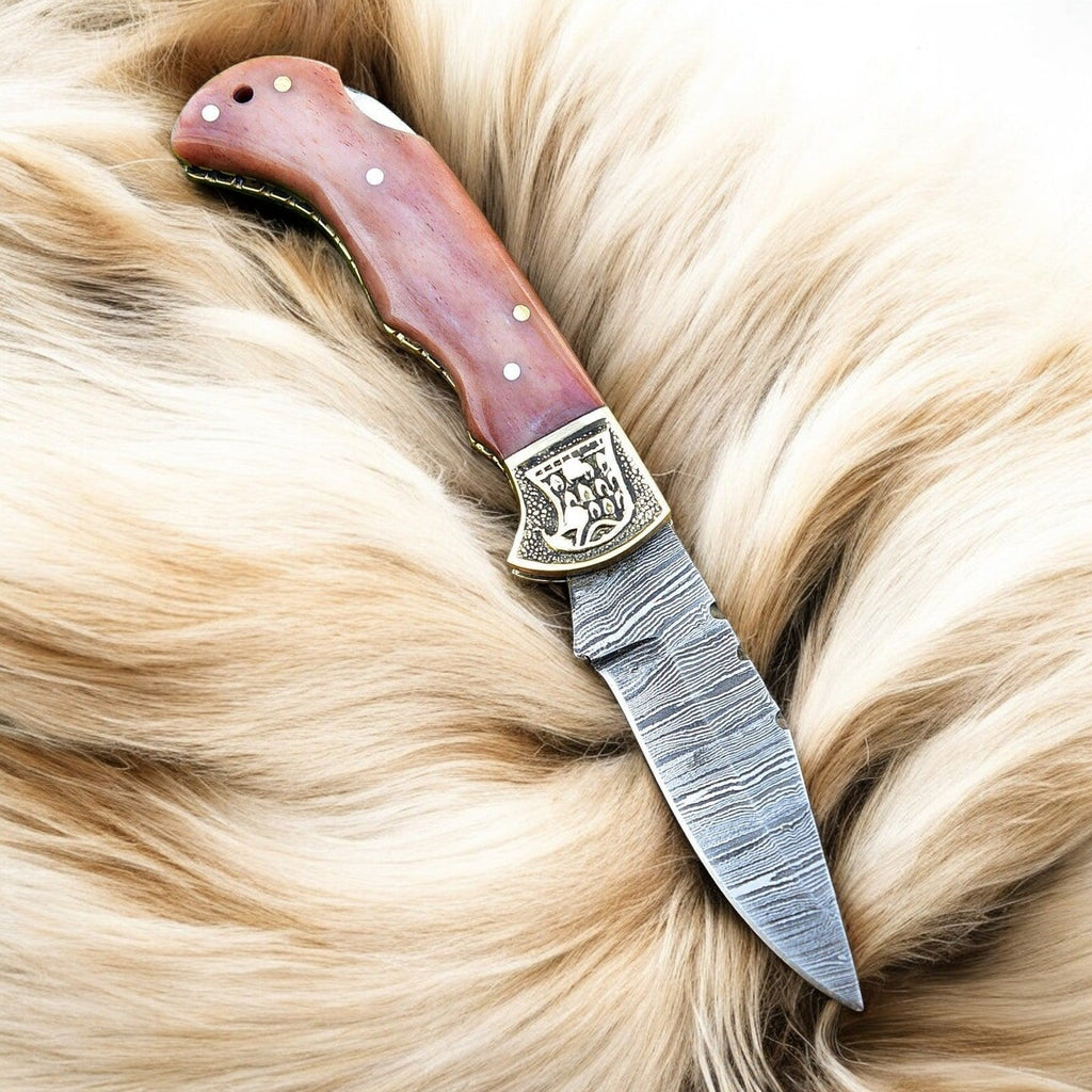 Custom handmade Damascus steel pocket clip knife with a 3-inch blade, featuring a detailed Damascus Knife Store design.