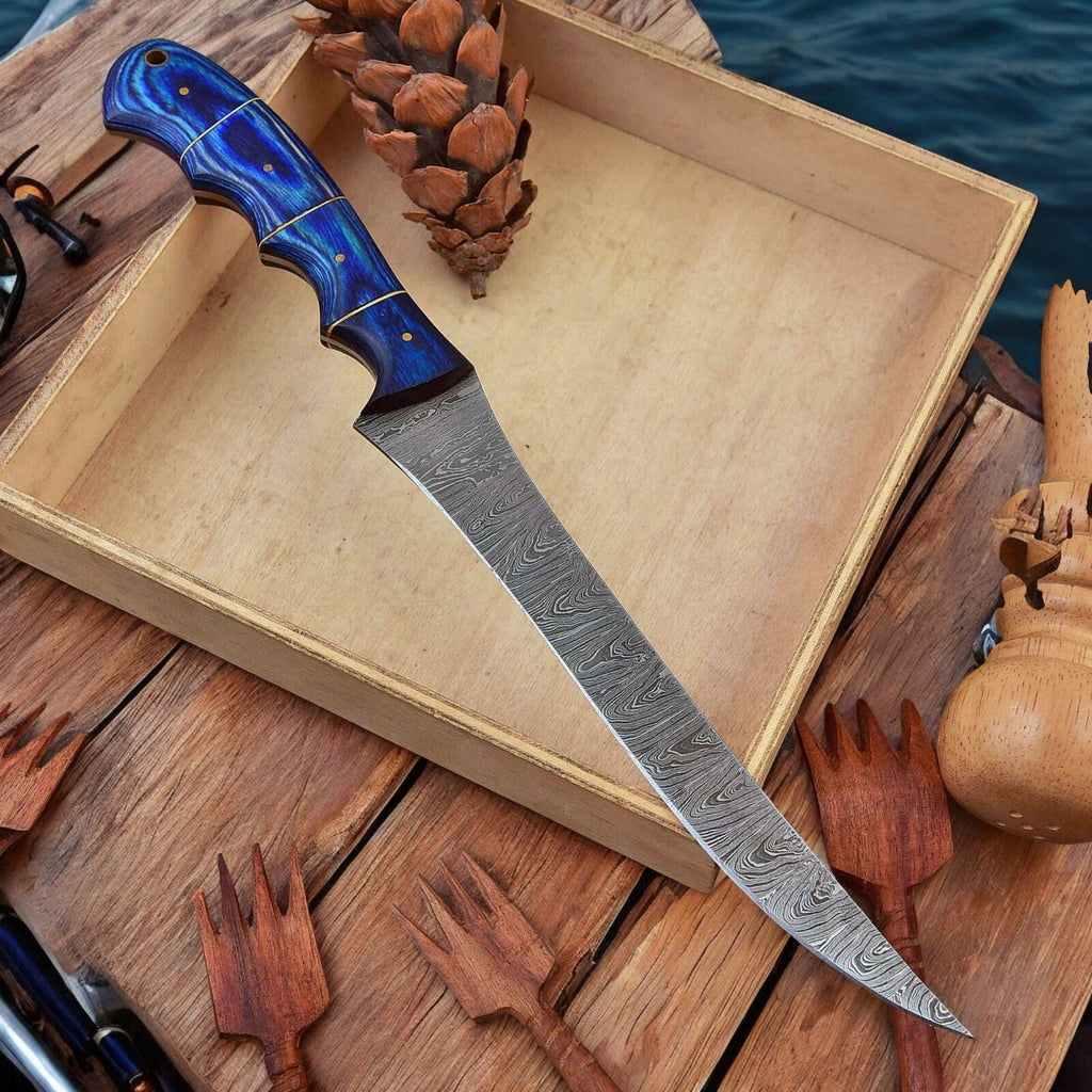 Custom handmade Damascus fillet knife with a 12-inch blade and exotic wood handle, featuring intricate Damascus steel patterns.