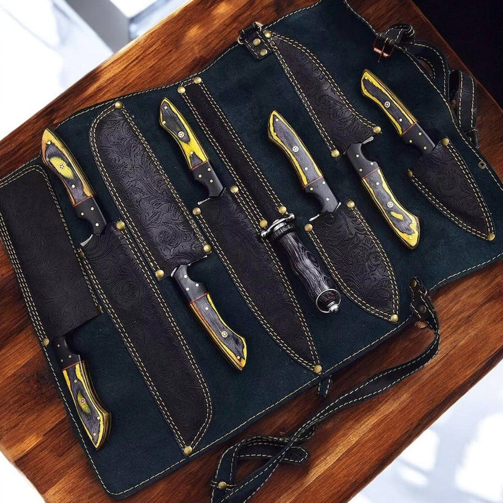 Handmade Damascus kitchen knives set with exotic wood and horn handles, showcasing polished blades and elegant craftsmanship.