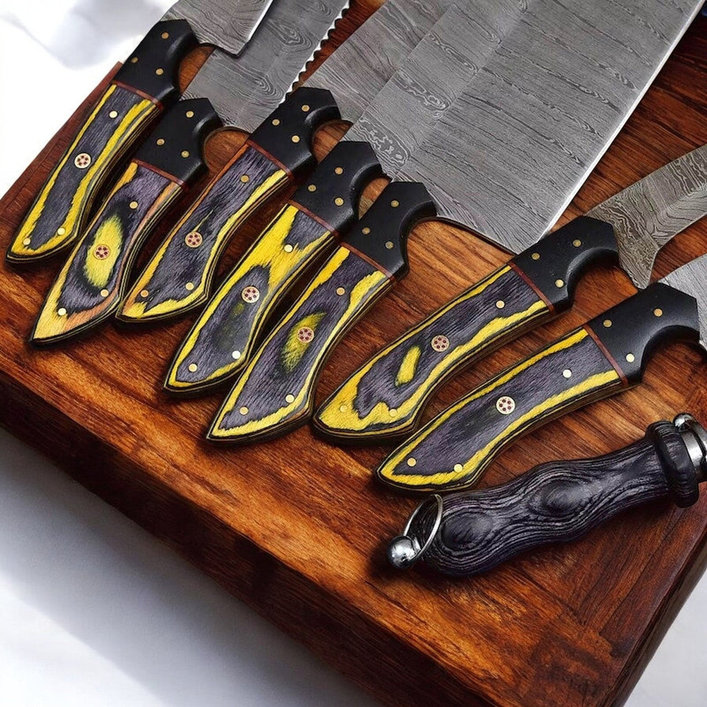 Handmade Damascus kitchen knives set with exotic wood and horn handles, showcasing polished blades and natural wood grain.