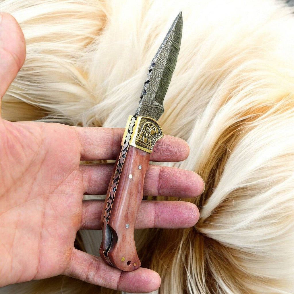 Custom handmade Damascus steel pocket clip knife with a 3-inch blade, featuring a sleek design and durable craftsmanship.