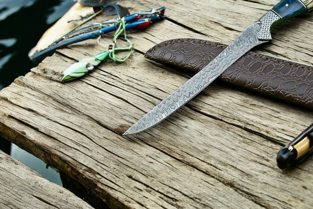 Custom handmade Damascus fillet knife with 12.5-inch blade and leather sheath, featuring intricate Damascus steel patterns.