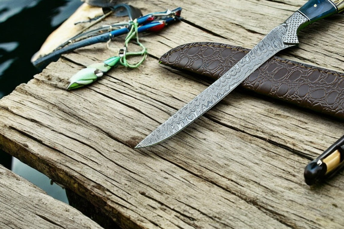 Custom handmade Damascus fillet knife with 12.5-inch blade and leather sheath, featuring intricate Damascus steel patterns.
