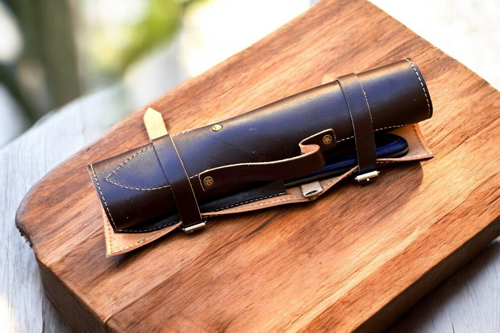 Handmade Damascus kitchen knives set with exotic wood handles, featuring sharp blades and polished wooden grips.