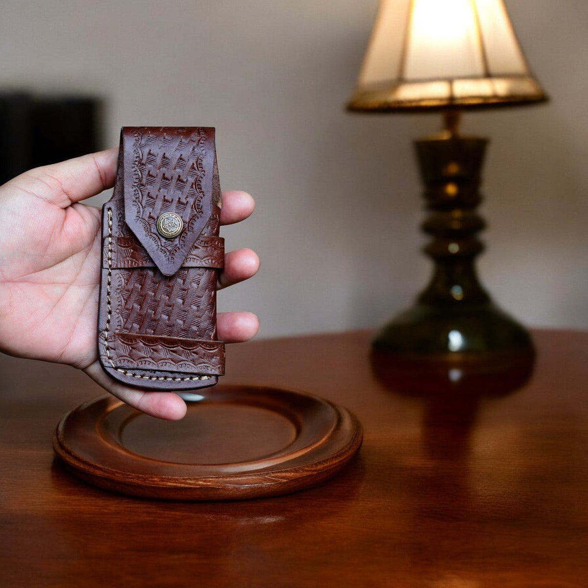 Handmade Damascus Wood pocket knife with a sharp blade and intricate wood handle, displayed on a neutral background.